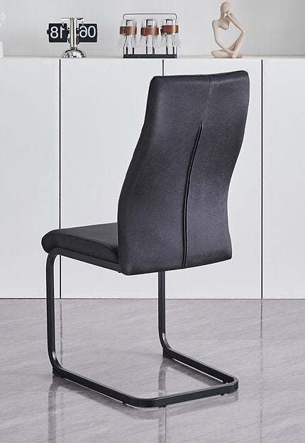 Extension Table: Grey Marble Veneer Top With X-Shape Black Steel Base  Chairs: Soft Black Velvet with Diamond Stitching Details, C-Shaped Black Steel Base